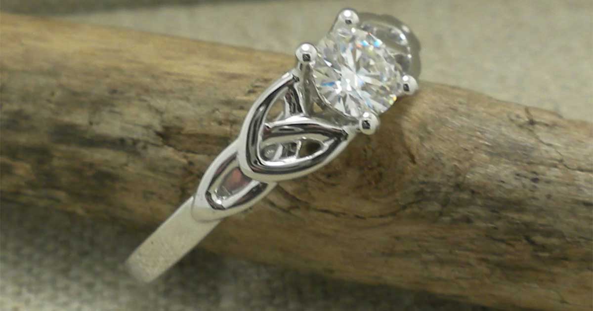 Irish Celtic engagement ring with diamond and Trinity knot setting