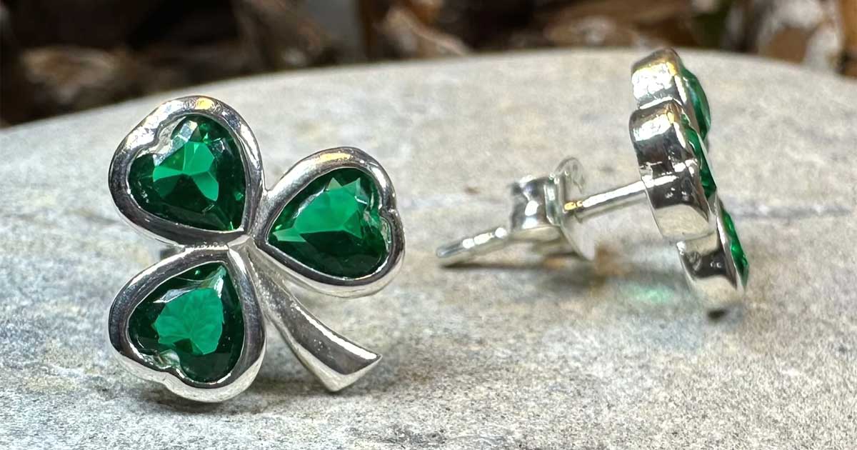 Irish shamrock earrings with green stones in sterling silver symbolizing Irish heritage